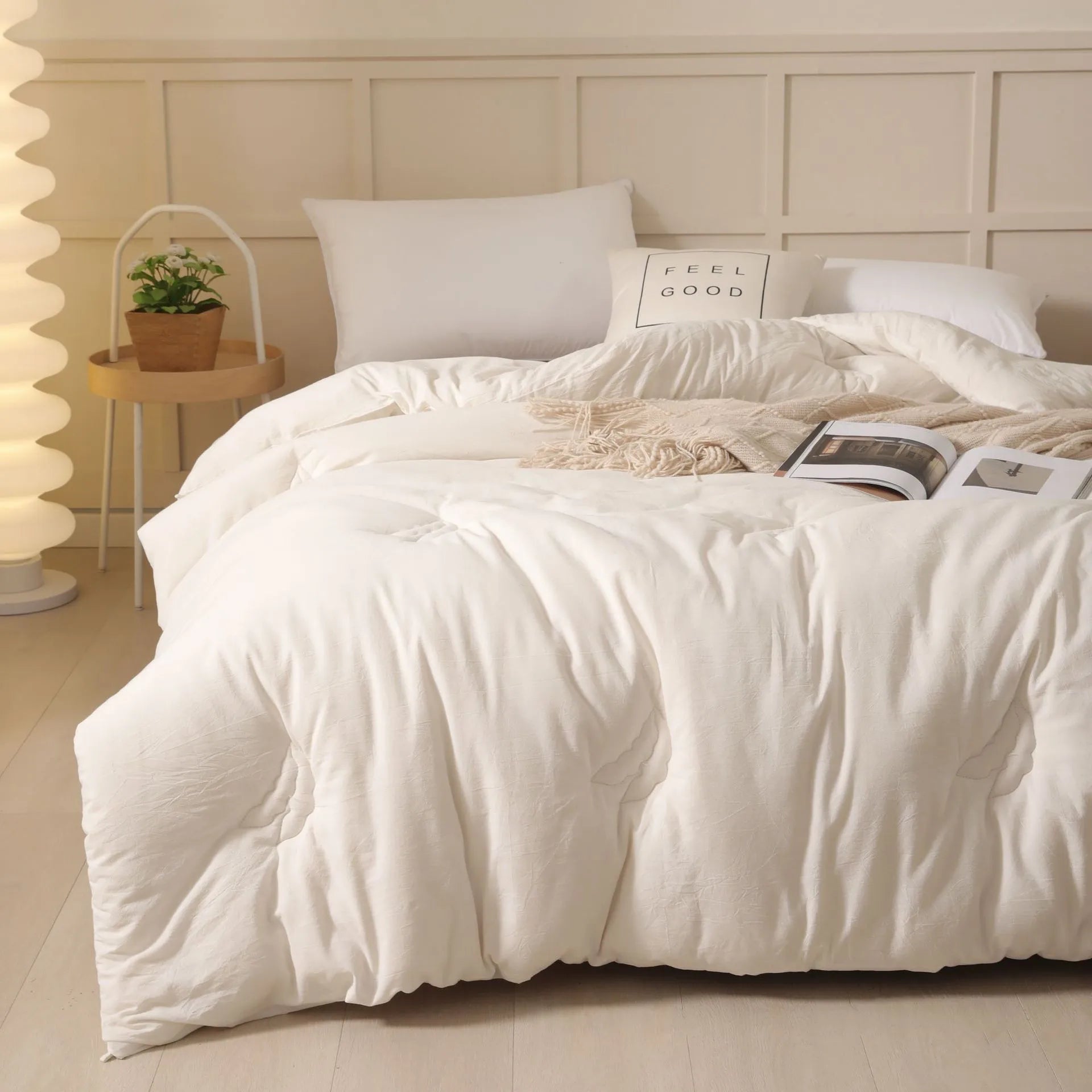 Soybean fibre filled pure cotton quilt in grey, shown on a bed in a 150x200cm size.