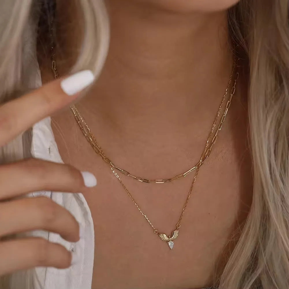 Women's 925 silver eagle pendant necklace on an adjustable O-ring chain in a white gold or yellow gold electroplated finish.