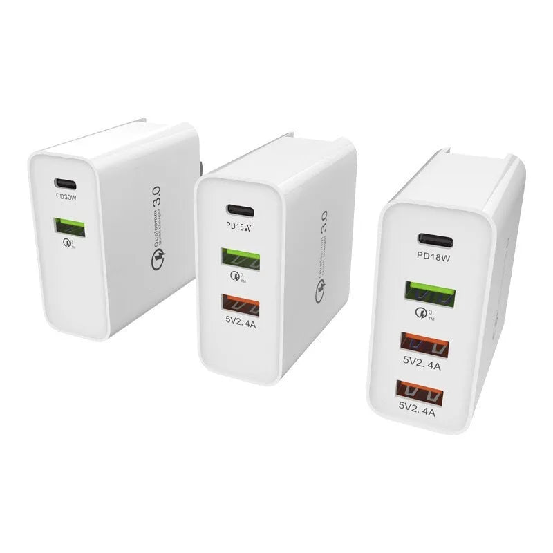 White multi-port fast charger with PD and QC 3.0 showing four USB ports.