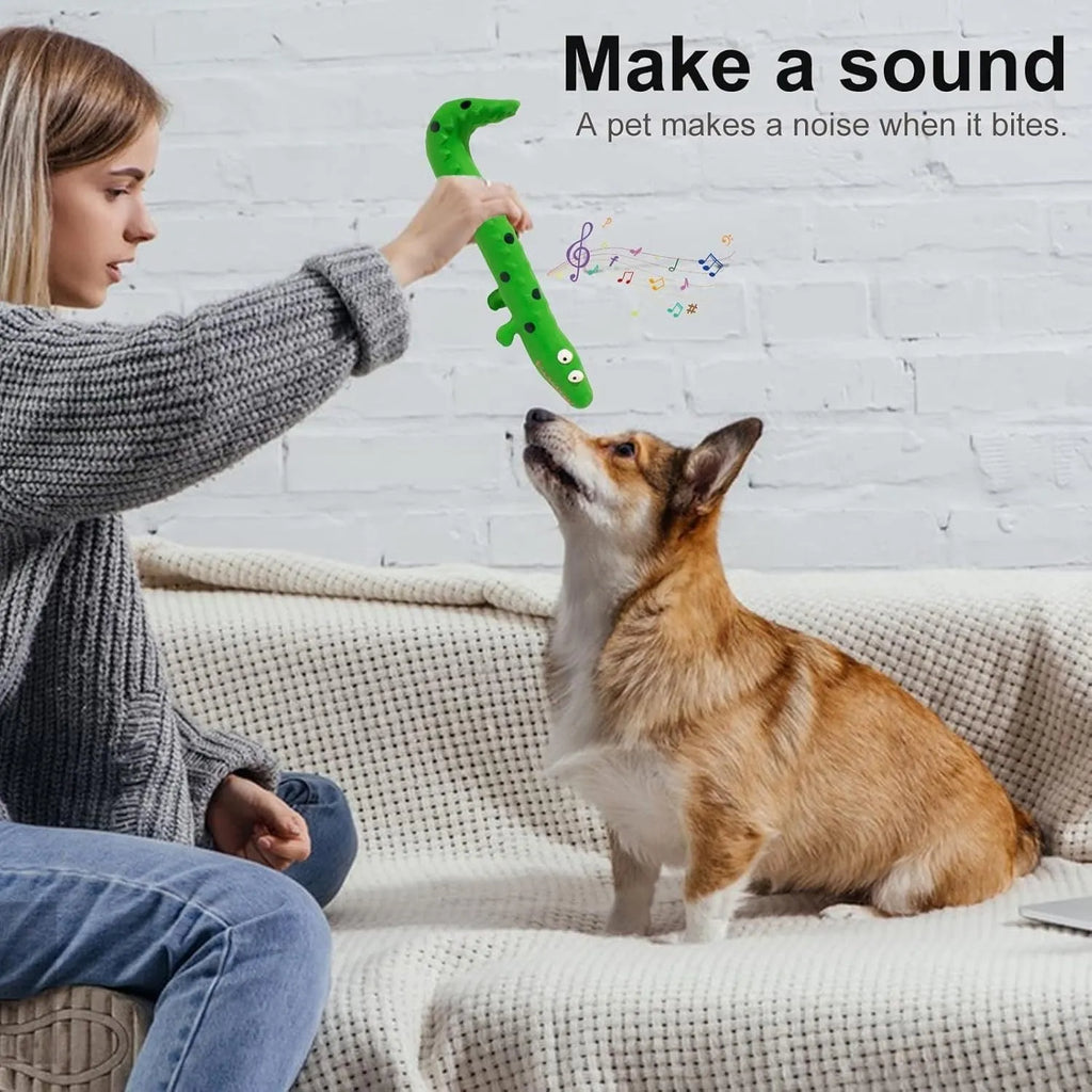 Green lizard-shaped dog chew toy with textured surface for teeth cleaning and squeaker inside