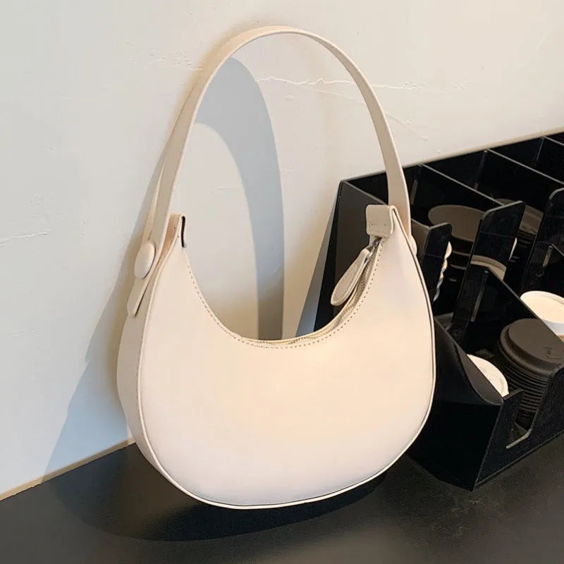 Women's retro dumpling-shaped shoulder bag in PU material with zipper organiser pocket