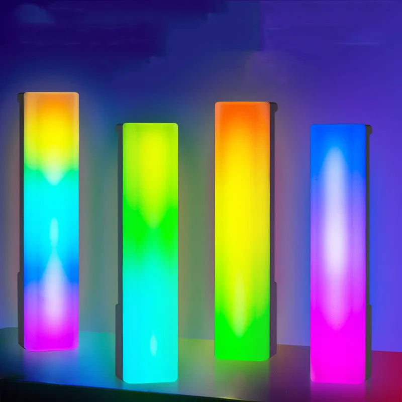 Black and white 3D RGB voice-activated music rhythm ambiance lamp on a table.