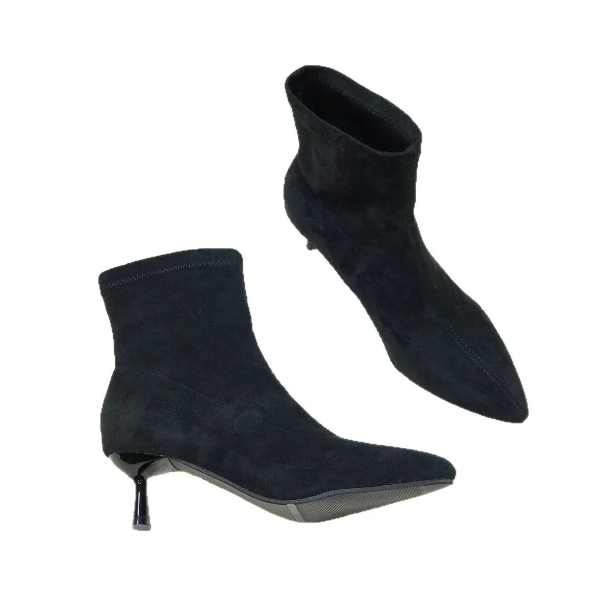 Black pointed toe ankle boots with a stiletto heel on a plain background.