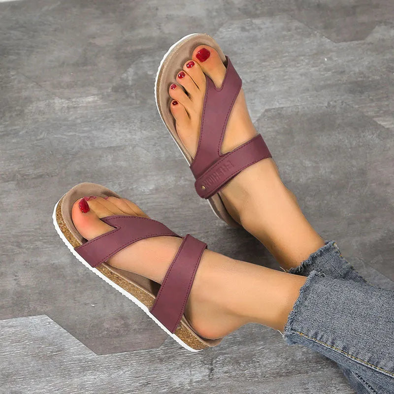 Women's blue flip-flops with a thick foam sole and a flat toe ring design on a solid colour artificial PU upper.