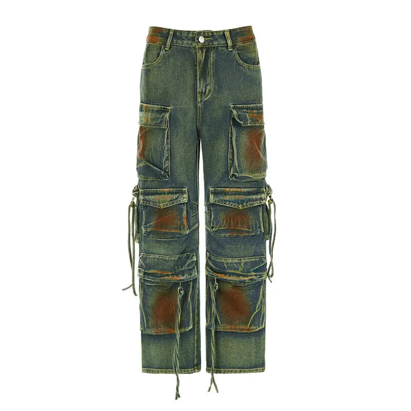 Women's loose cargo denim trousers with a colour bloom wash and gradient colour pockets on a street style background.