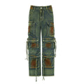 Women's loose cargo denim trousers with a colour bloom wash and gradient colour pockets on a street style background.