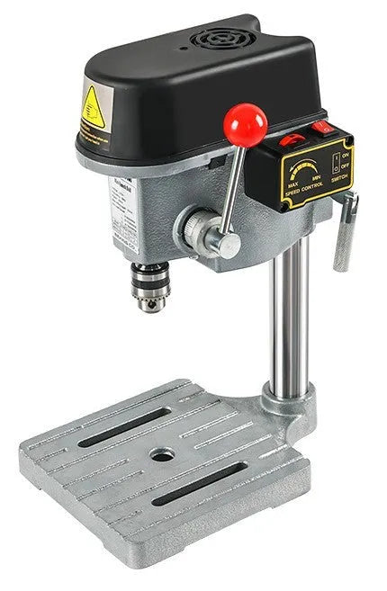 Mini bench drill and milling machine with heavy-duty cross bench pliers on workshop bench