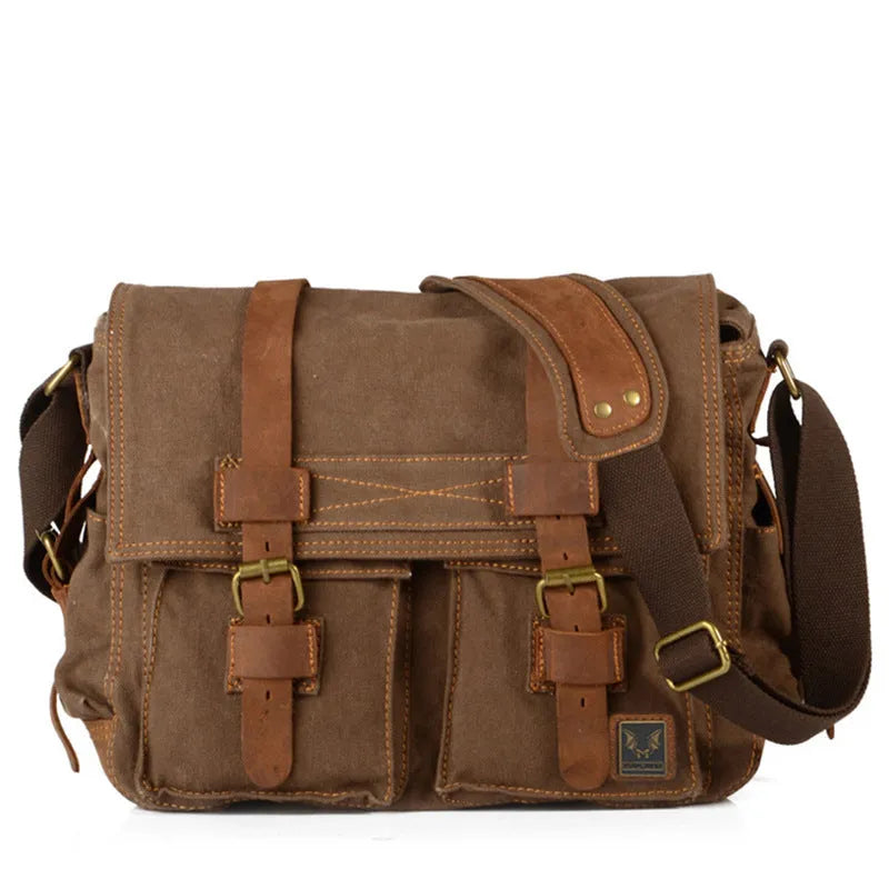 Men's canvas crossbody shoulder bag with cowhide trim showing internal organisers