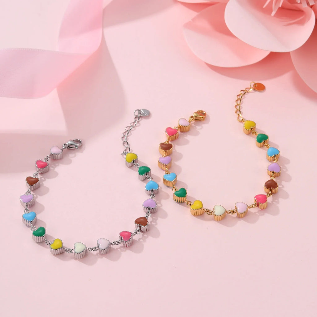 Gold or steel tone stainless steel love heart pendant bracelet for women.
