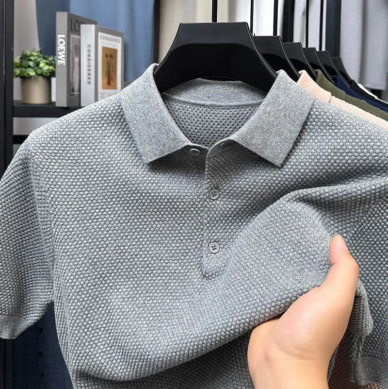 Men's loose fit short sleeve cotton pullover sweater in grey, shown on a model.
