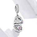 Silver electroplated loose bead pendant 2.3cm high 1cm wide on plain background