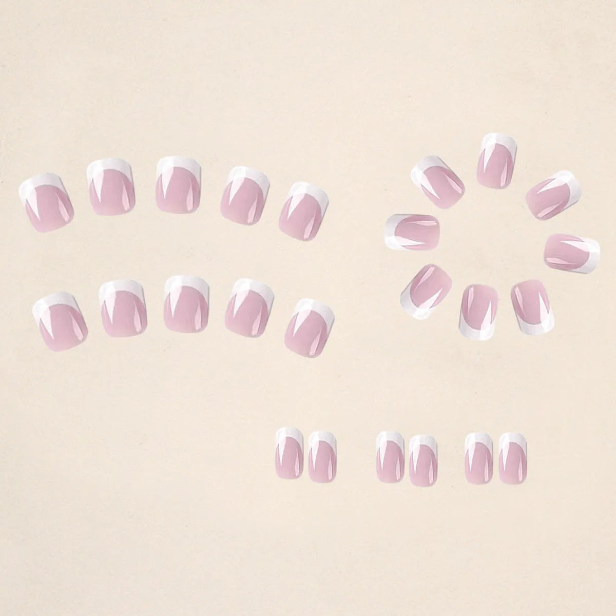 24 white acrylic nail tips with plaid pattern design arranged on display
