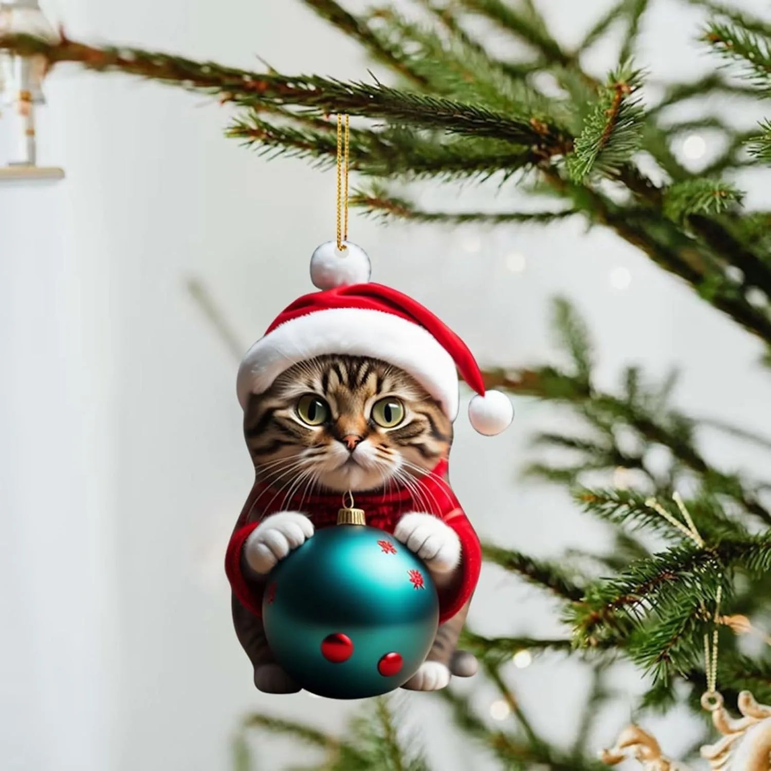 Cartoon style creative kitty Christmas ornament hanging in a car, made from clear acrylic.