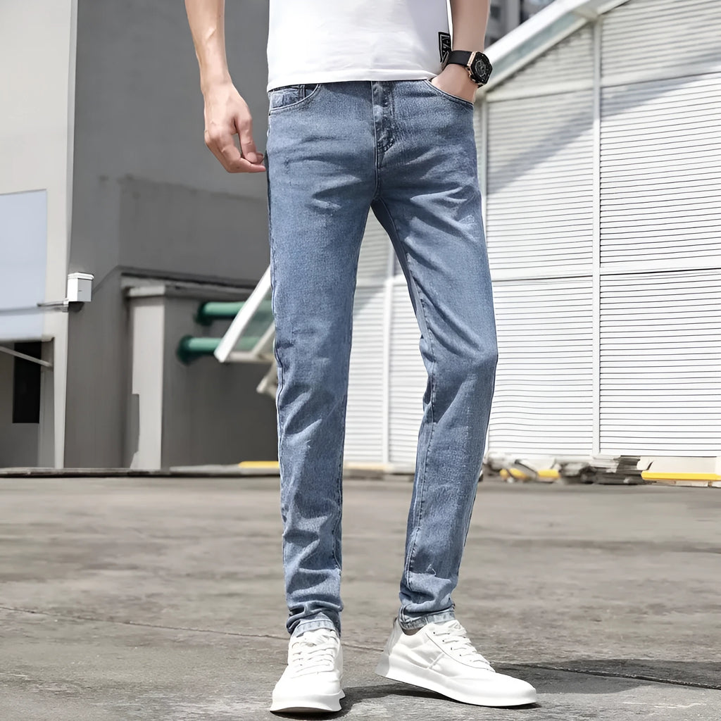 Men's Korean-style light blue tapered jeans with polyester denim blend fabric