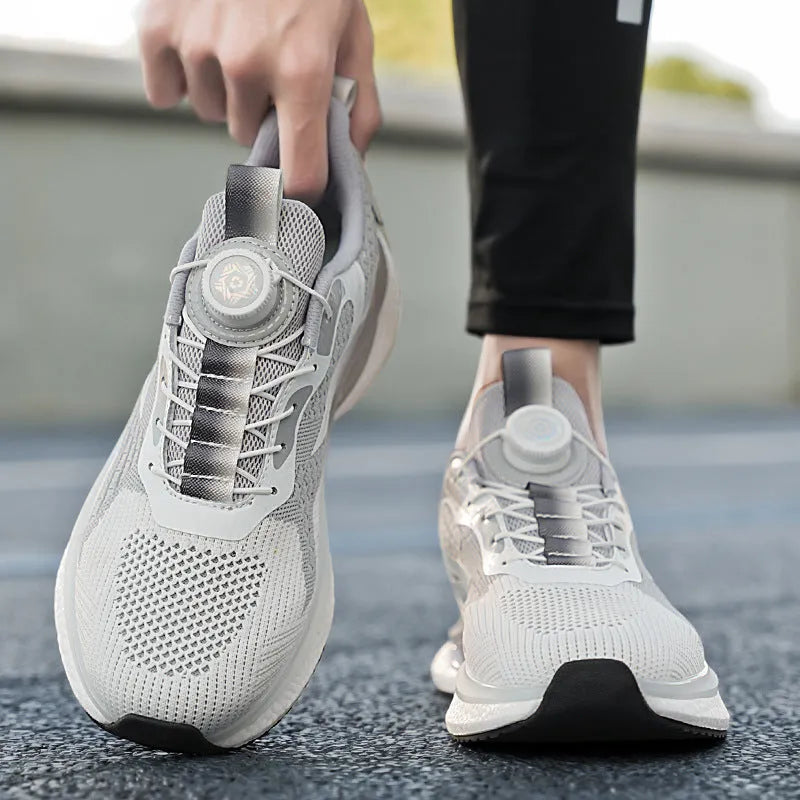 Men's white Korean-style running shoes with a rotating buckle closure and mesh upper.