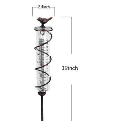Cast iron garden rain gauge with hummingbird ornament and measurement scale.