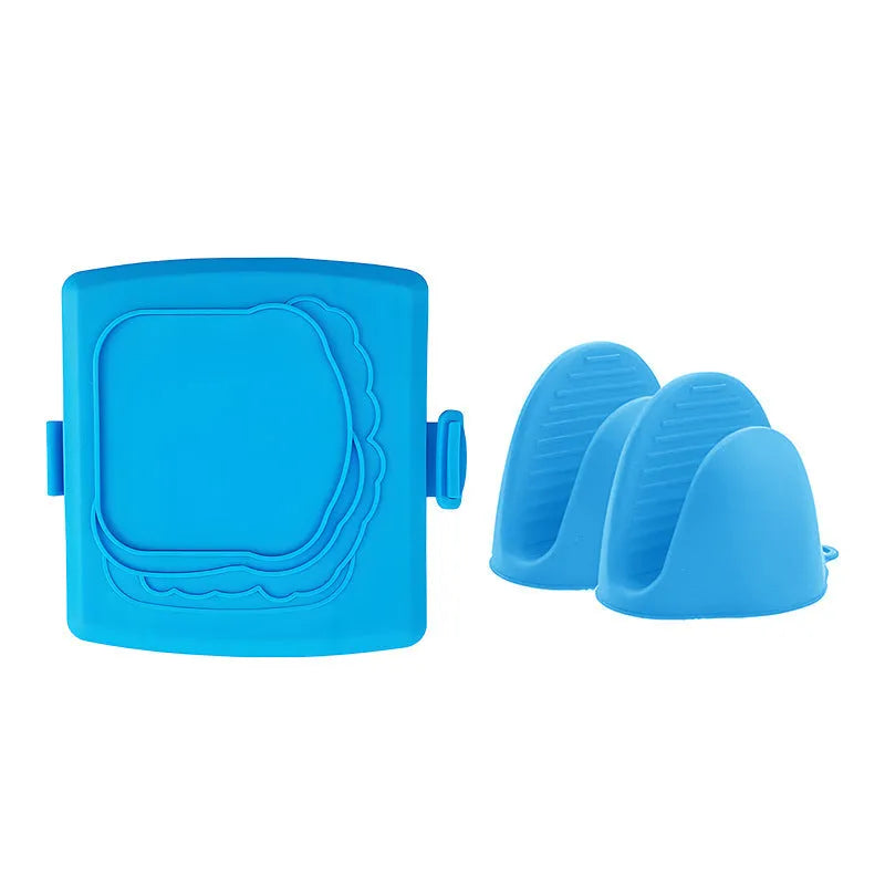 Red silicone baking tray with integrated handbag-style handles and matching oven gloves