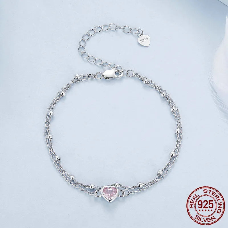 Women's sweet girlish style sterling silver bracelet with a small heart charm on an adjustable chain.
