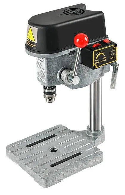 Mini bench drill and milling machine with heavy-duty cross bench pliers on workshop bench