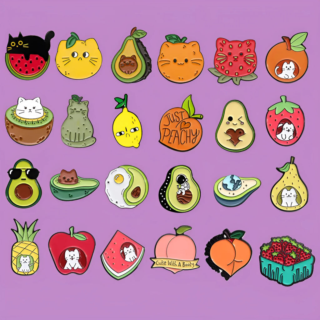 Colourful zinc alloy metal brooch with cartoon fruit and letter design on fabric.