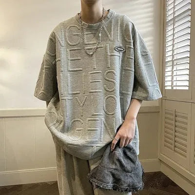 Men's grey t-shirt with raised letter pattern, short sleeves, loose fit