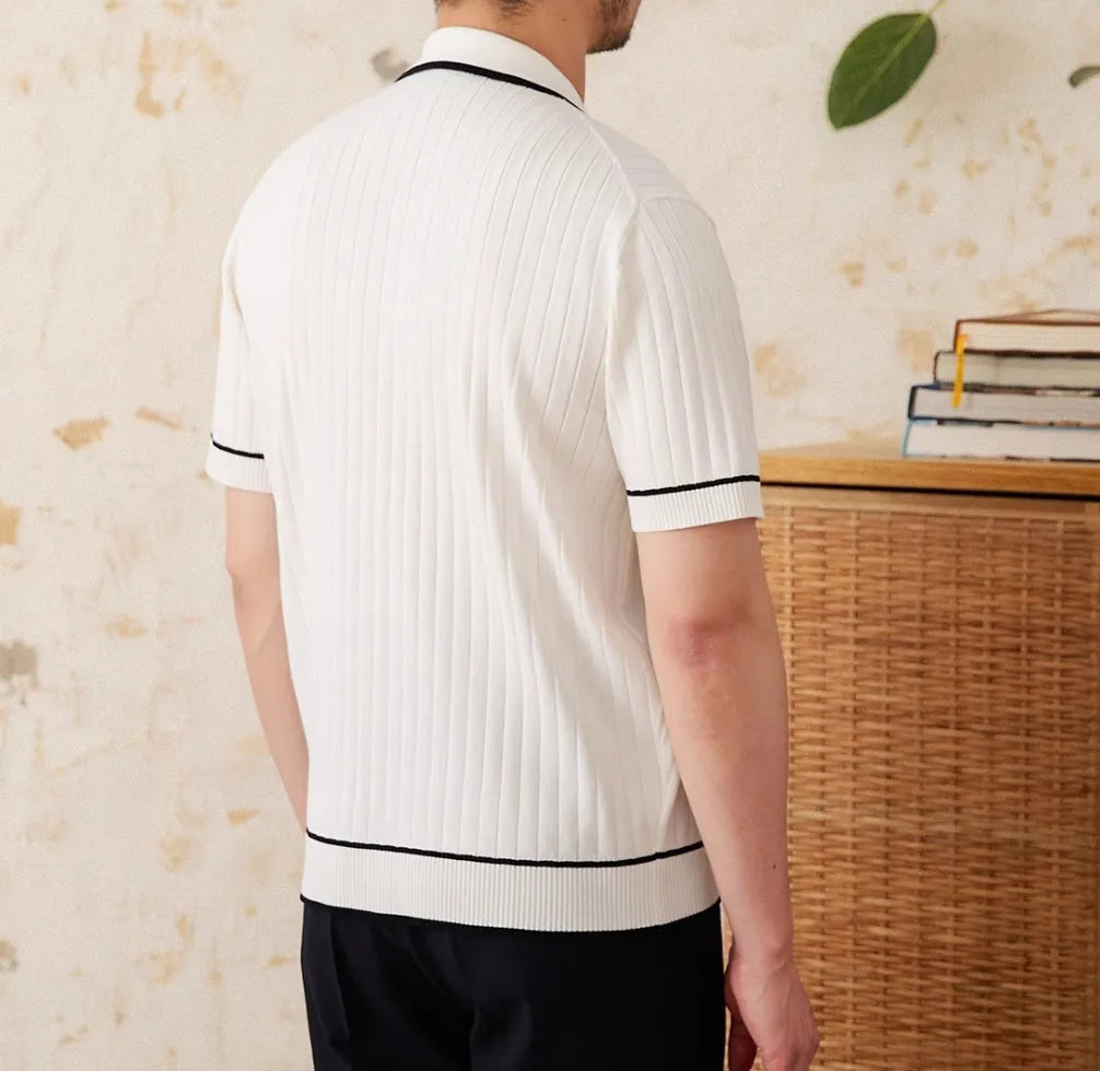 Slim fit black knitting polo shirt with short sleeves and lapel collar on a male model