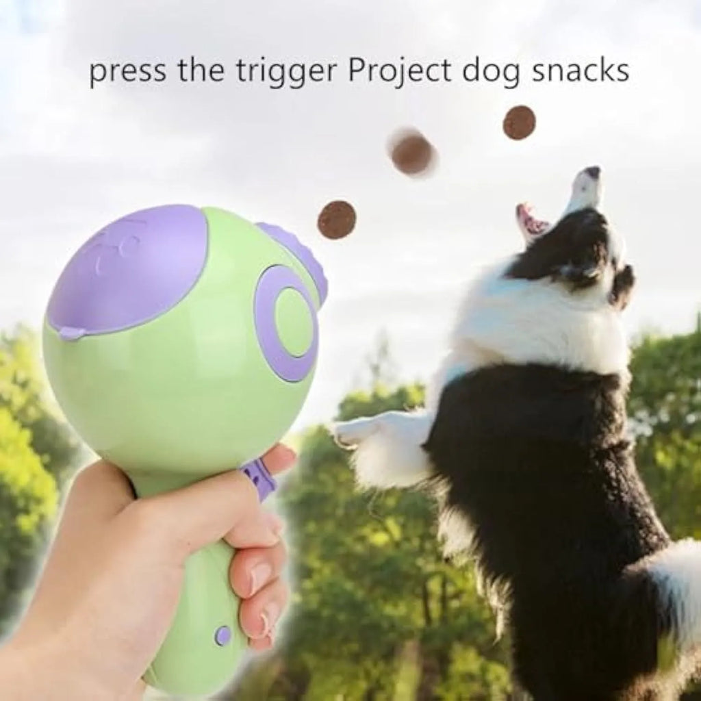Green dog treat launcher toy measuring 15.5 × 9 × 8.5 cm for interactive play and remote feeding