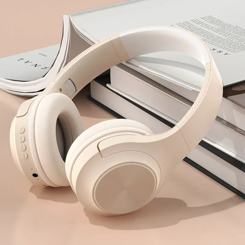Wireless Bluetooth over-ear headset in ivory white colour with creative design and charging case