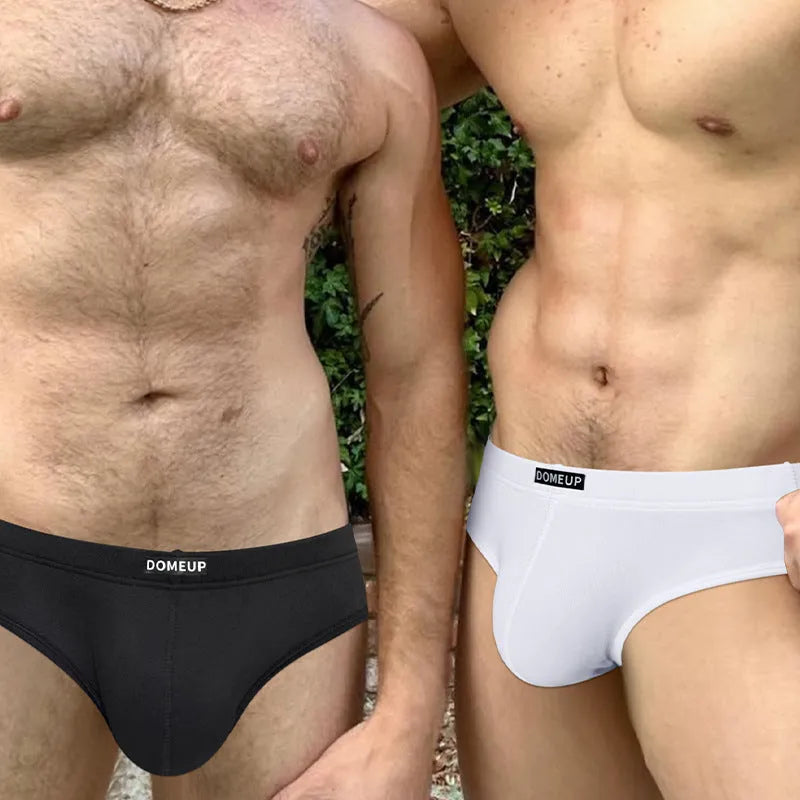 Men's solid colour breathable briefs with seamless low-waist construction in white, black, and pink colours