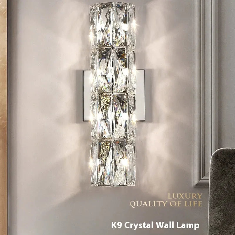 Crystal shade stainless steel wall lamp in chrome finish mounted on a wall.
