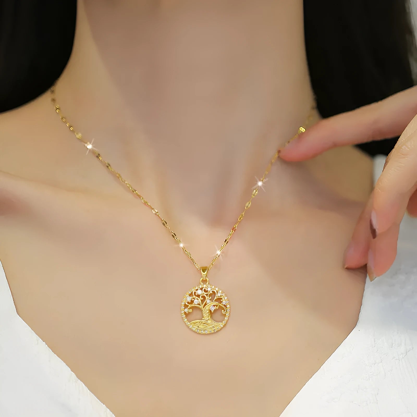 Gold-plated women's necklace with detailed lucky tree pendant featuring zircon stones and mother of pearl shell