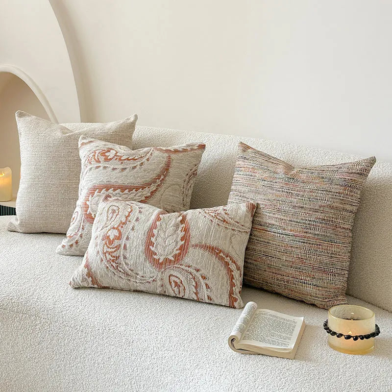 American-style paisley jacquard sofa backrest cushion in Amber colour on a grey sofa.
