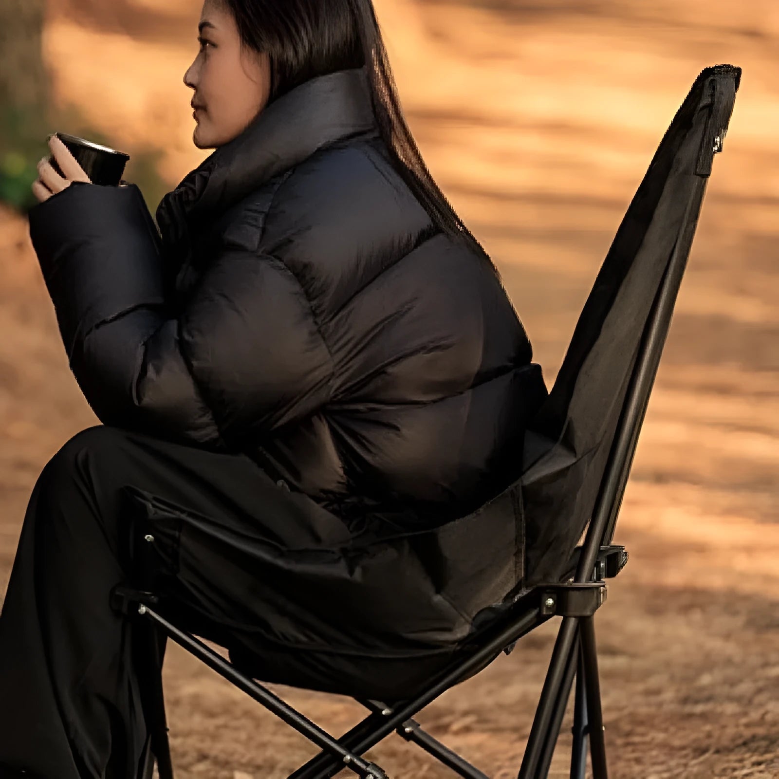 Night black folding camping moon chair with Oxford cloth fabric in folded position