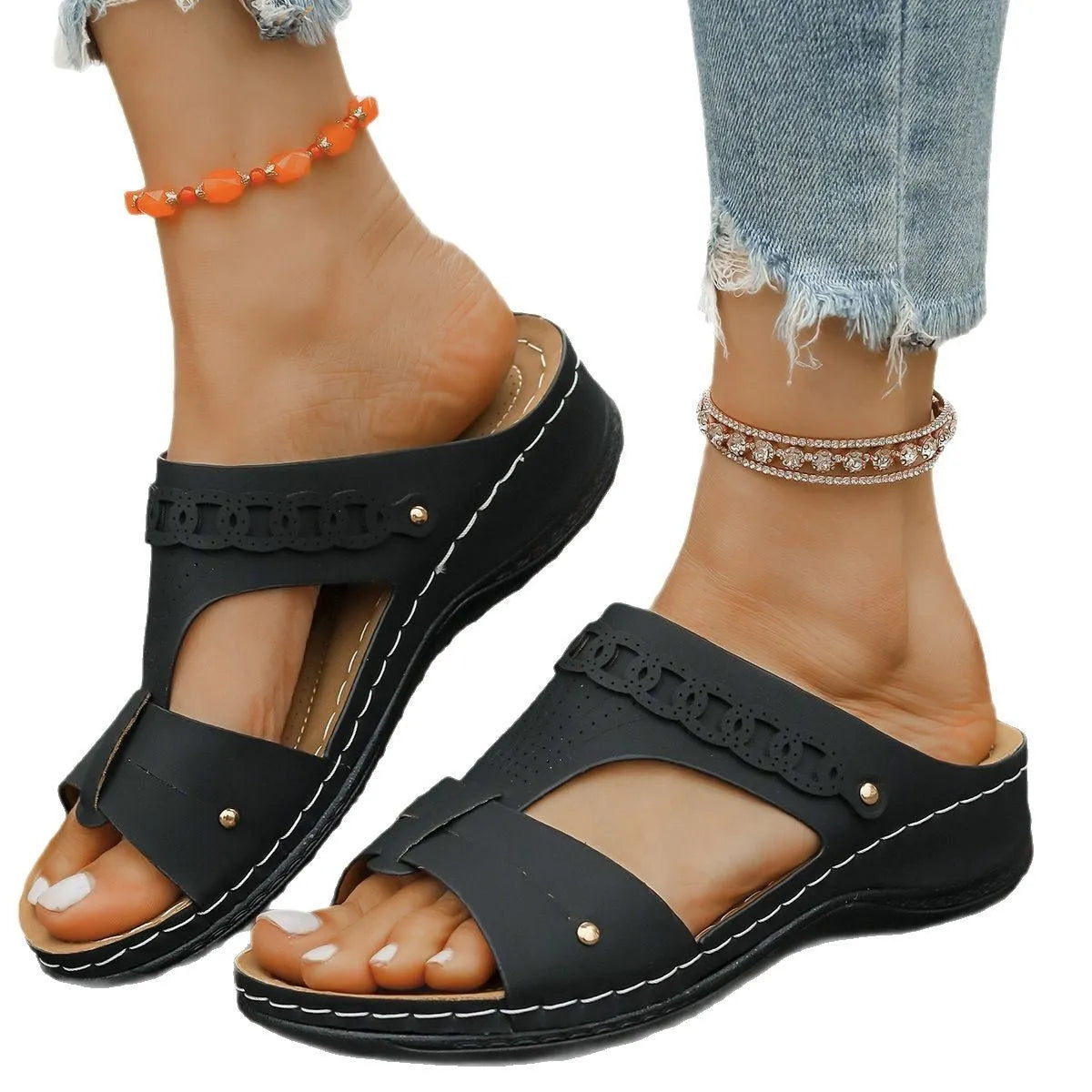 Casual slope heel roman style slippers in blue with fish mouth toe design and rubber sole.