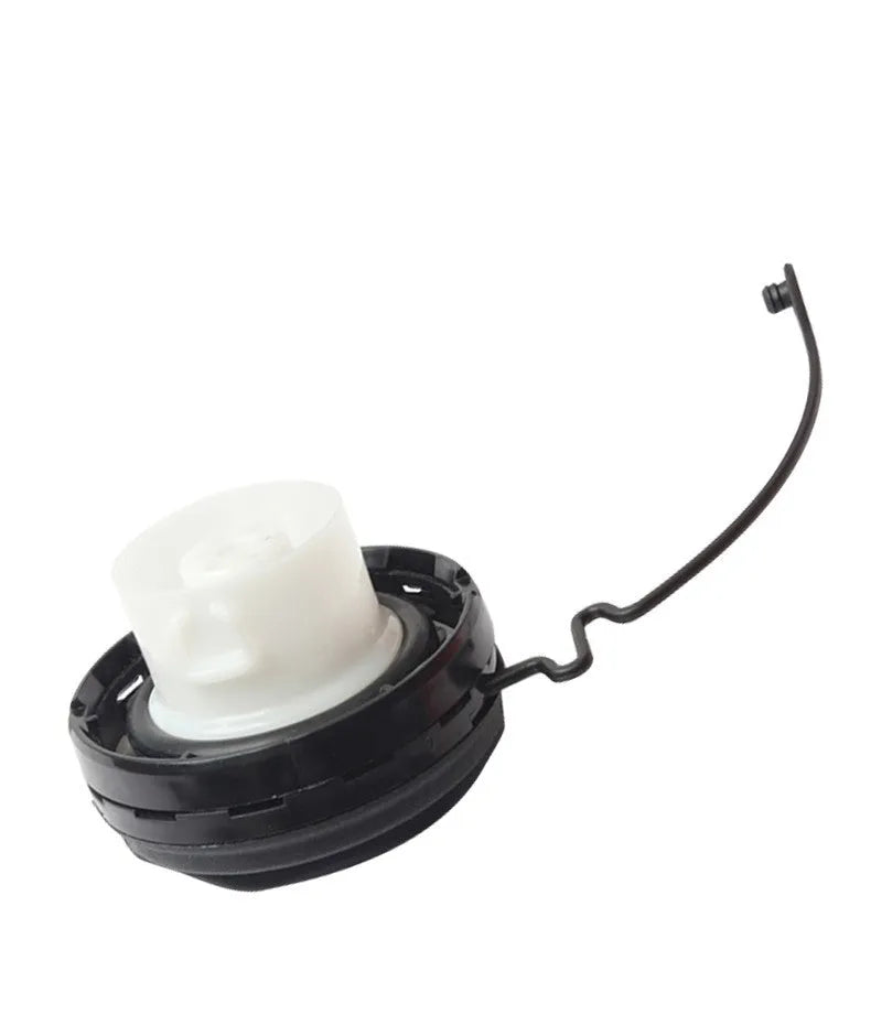 Toyota replacement snap-in fuel tank cap showing black plastic construction