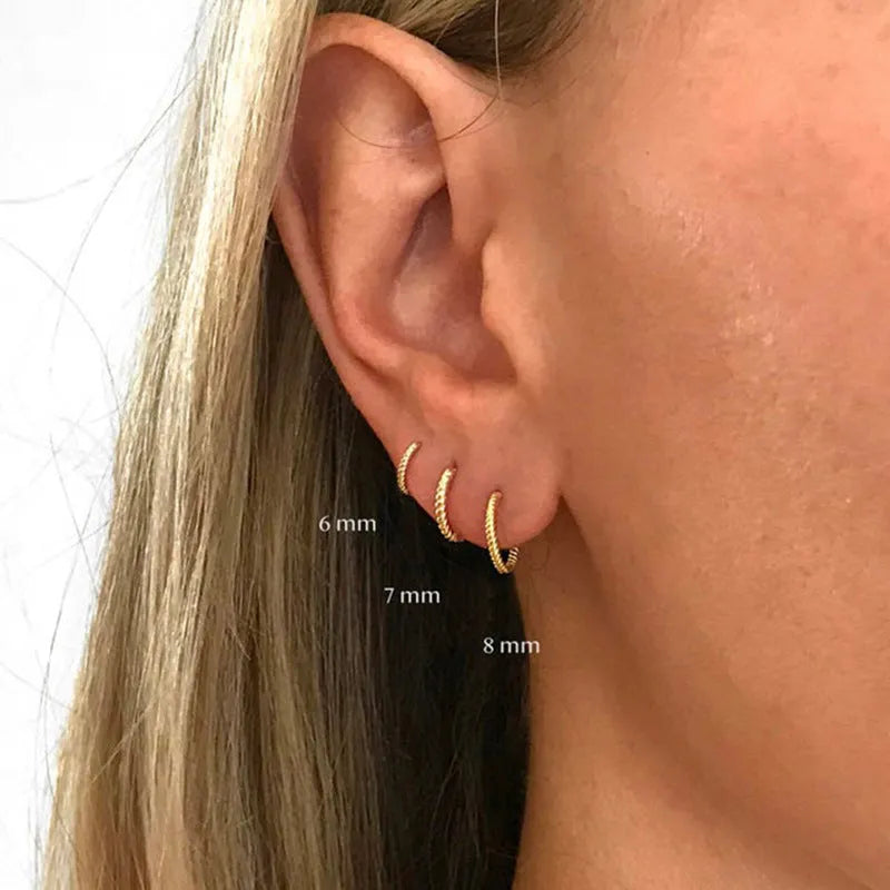 S925 sterling silver twisted string round earrings in gold and white gold finishes showing geometric design