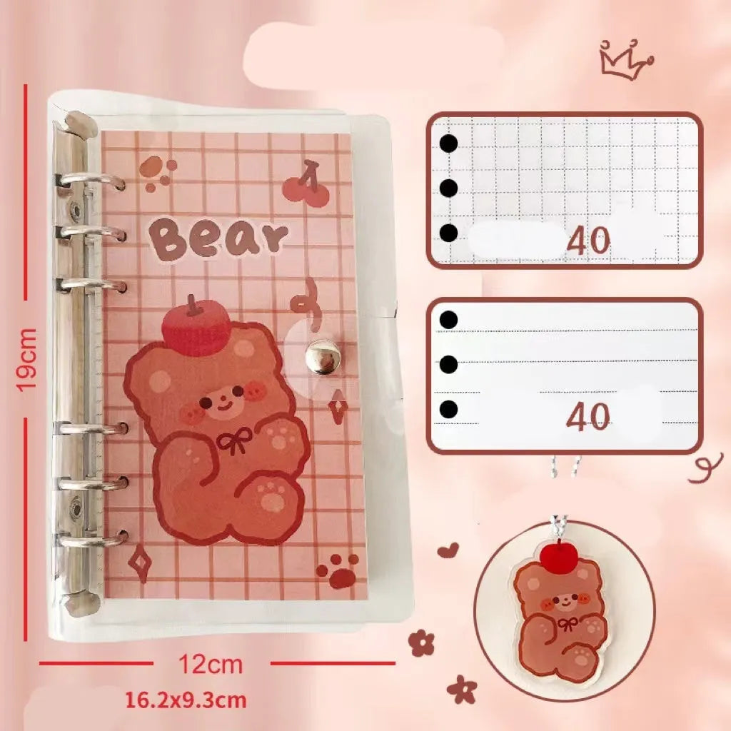 A6 size loose-leaf coil notebook with heart-themed bear design, showing coil binding and 6-hole edge.