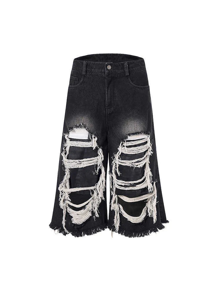 Black women's cropped wide-leg jeans with mid-high waist and ripped patch detail