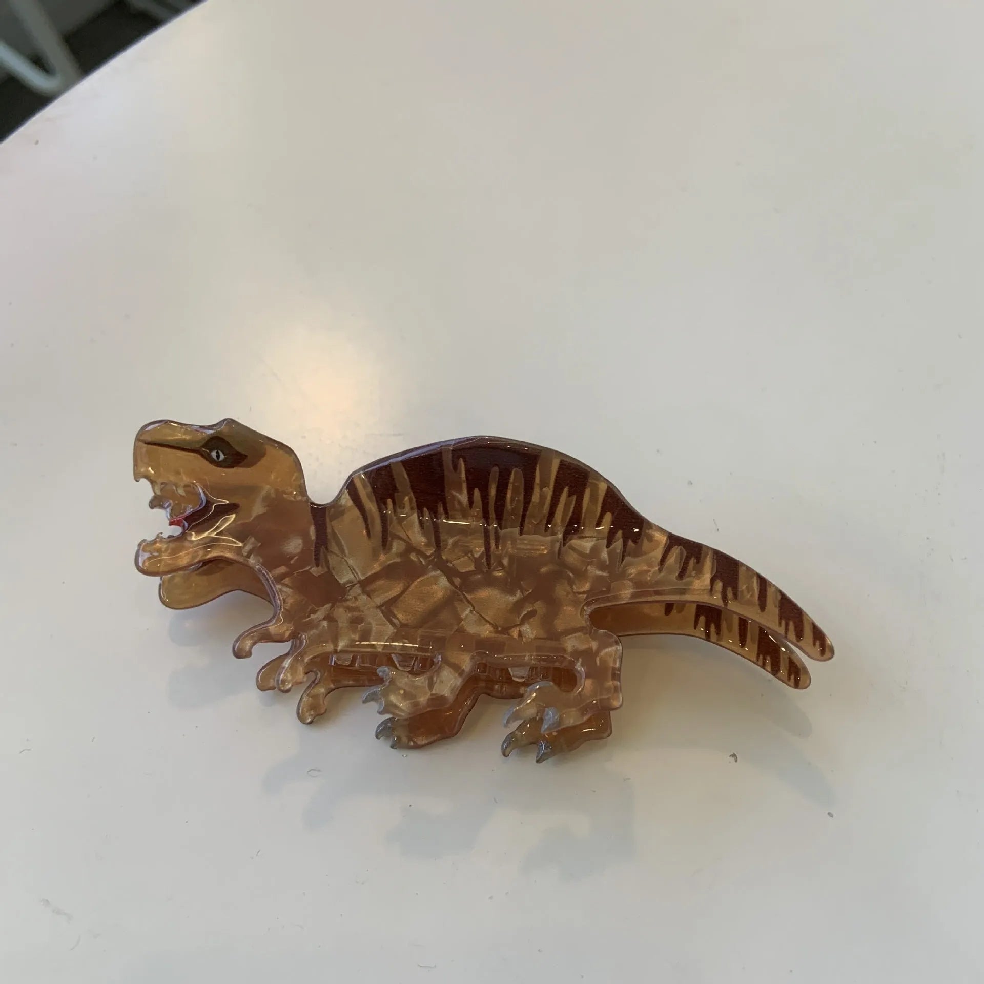 Acrylic dinosaur hair clip with jaw grip closure in one of six colourful designs