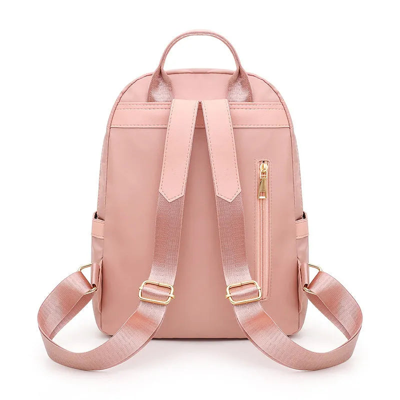 Black or pink casual nylon backpack with waterproof features and organised internal compartments