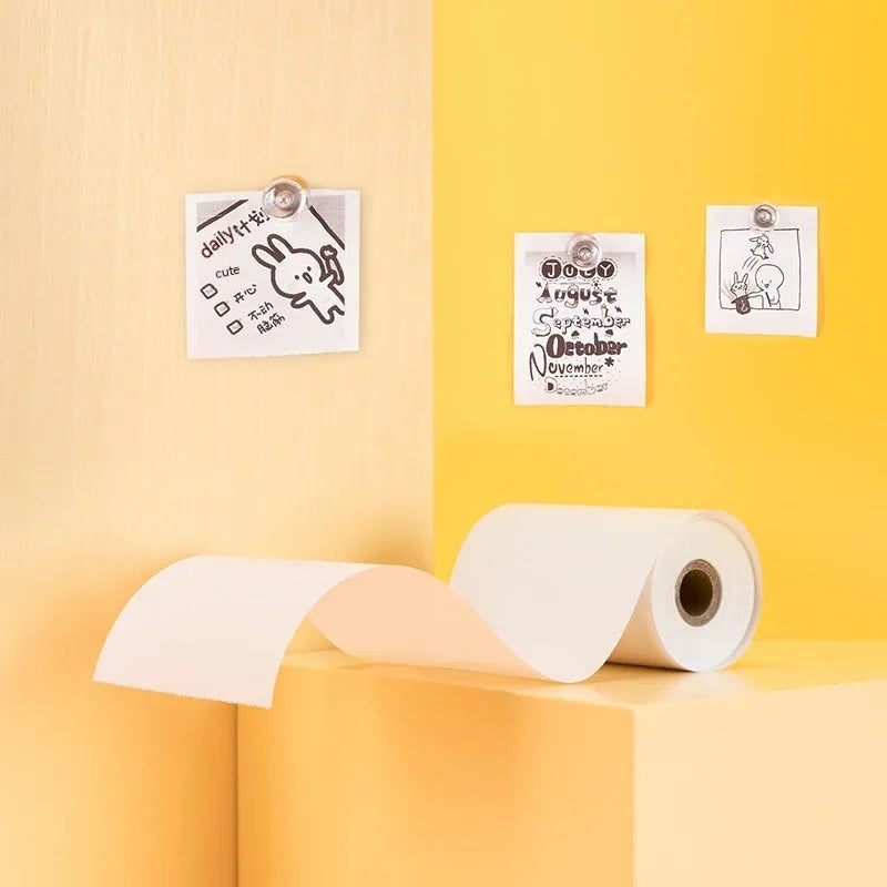 Three rolls of 57mm x 30mm thermal paper in packaging for small printers