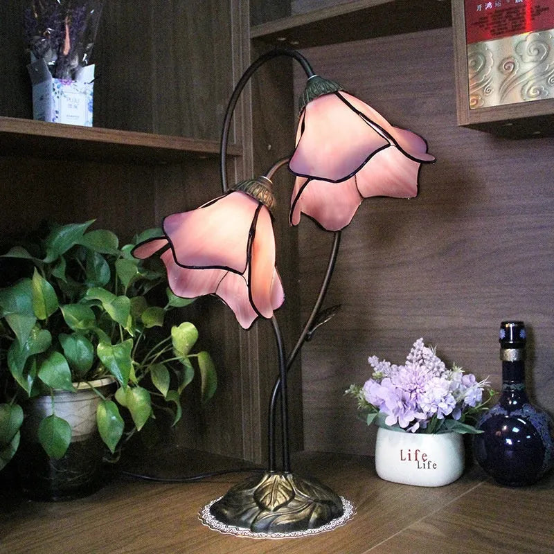 Retro American glass lotus desk lamp with double head pink shade on table