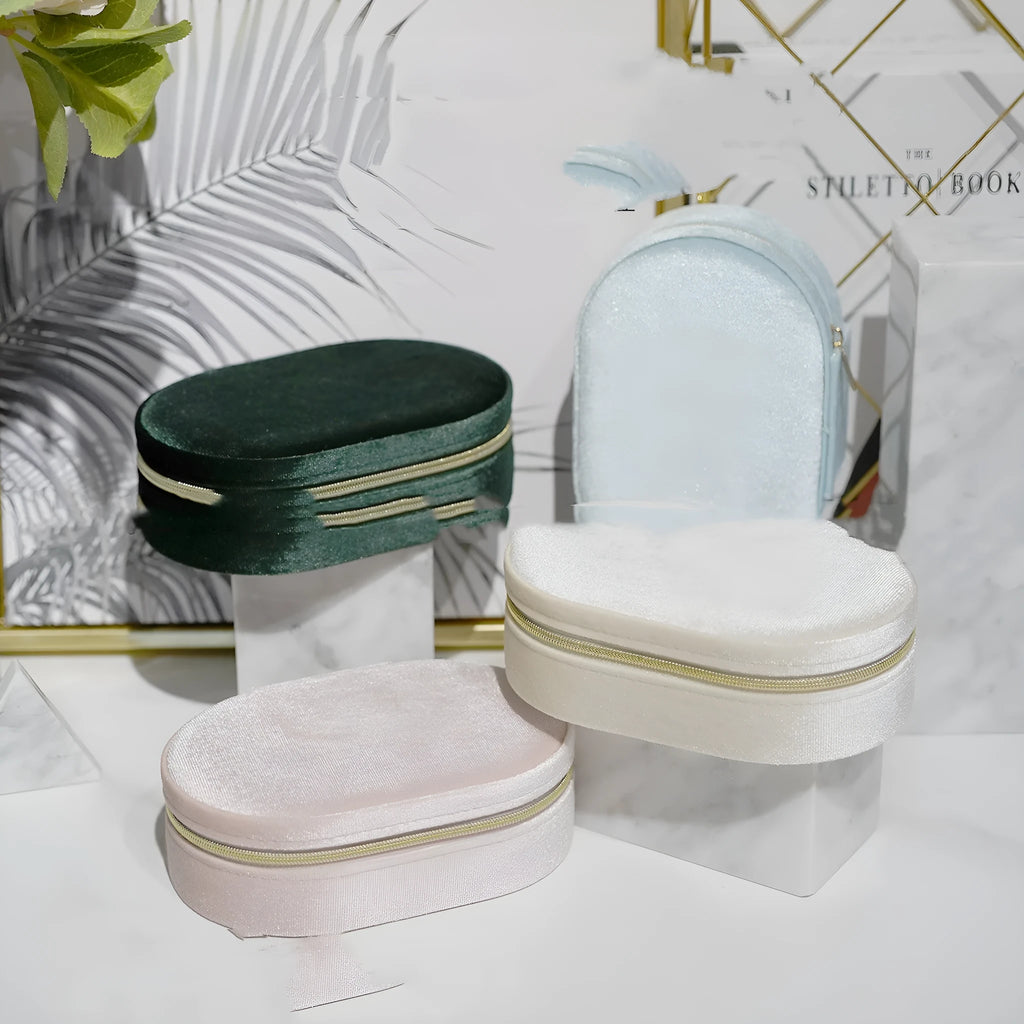 Oval velvet jewellery storage box with soft flannel interior in multiple colour options.