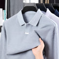 Men's loose fit cotton polo shirt with lapel collar in grey shown front view