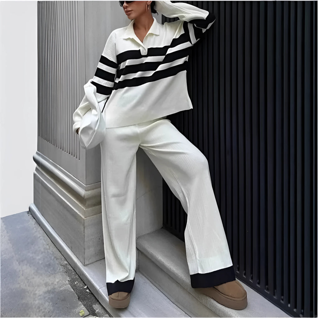 Women's black and white striped knitted polo shirt and trouser two-piece set.