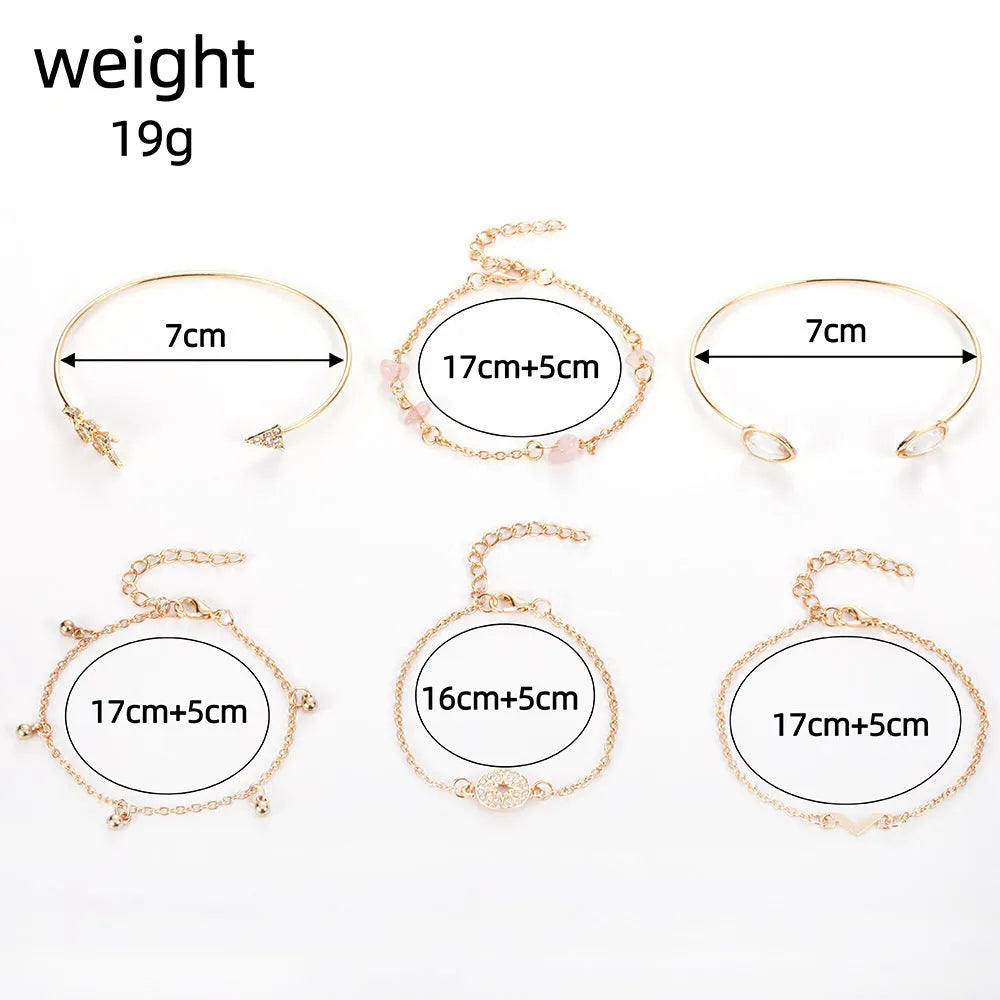 Gold-coloured zinc alloy bracelet set with six charms including arrow, water drop, V, and spot drill designs.