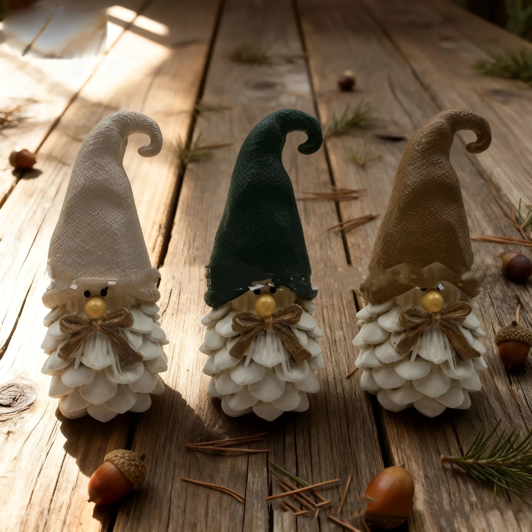 Three resin pine cone decorations in brown dwarf pine cone design, each 9x5x4cm