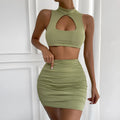 Light purple women's two-piece set with hollow vest top and matching hip skirt