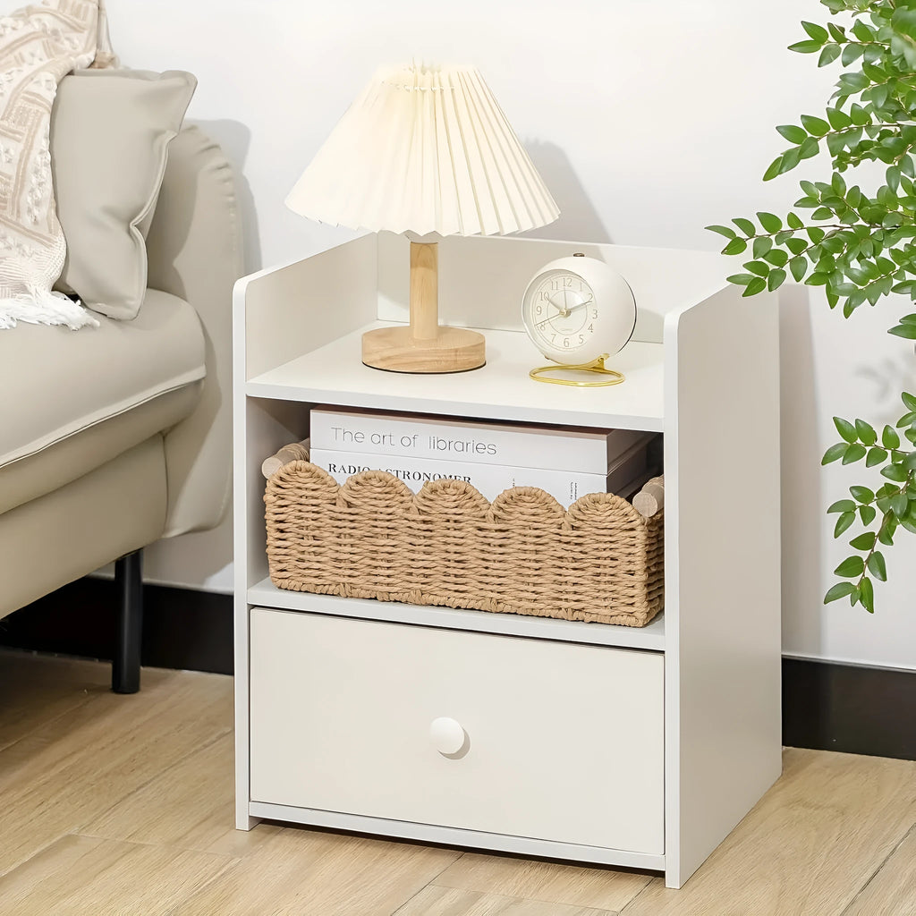 Modern weaved paper storage basket in khaki holding remote controls and stationery on a desktop