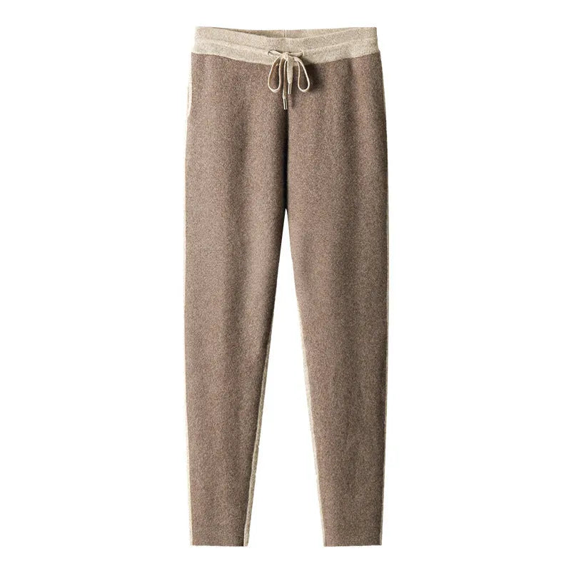 Man wearing a camel-coloured cashmere blend half turtleneck zip cardigan and matching trousers.